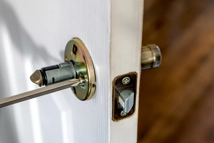 how-to-fix-a-loose-lever-door-handle-5222471-04-c0aea79eebf642e1bb378dd872b68742.webp